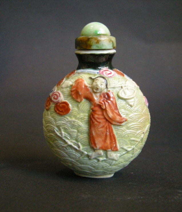 Rare porcelain snuff bottle molded  probably immortal He Xiangu